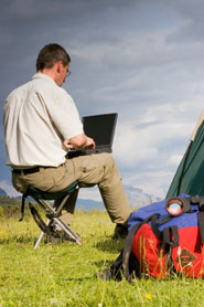 Man accessing Web from campsite